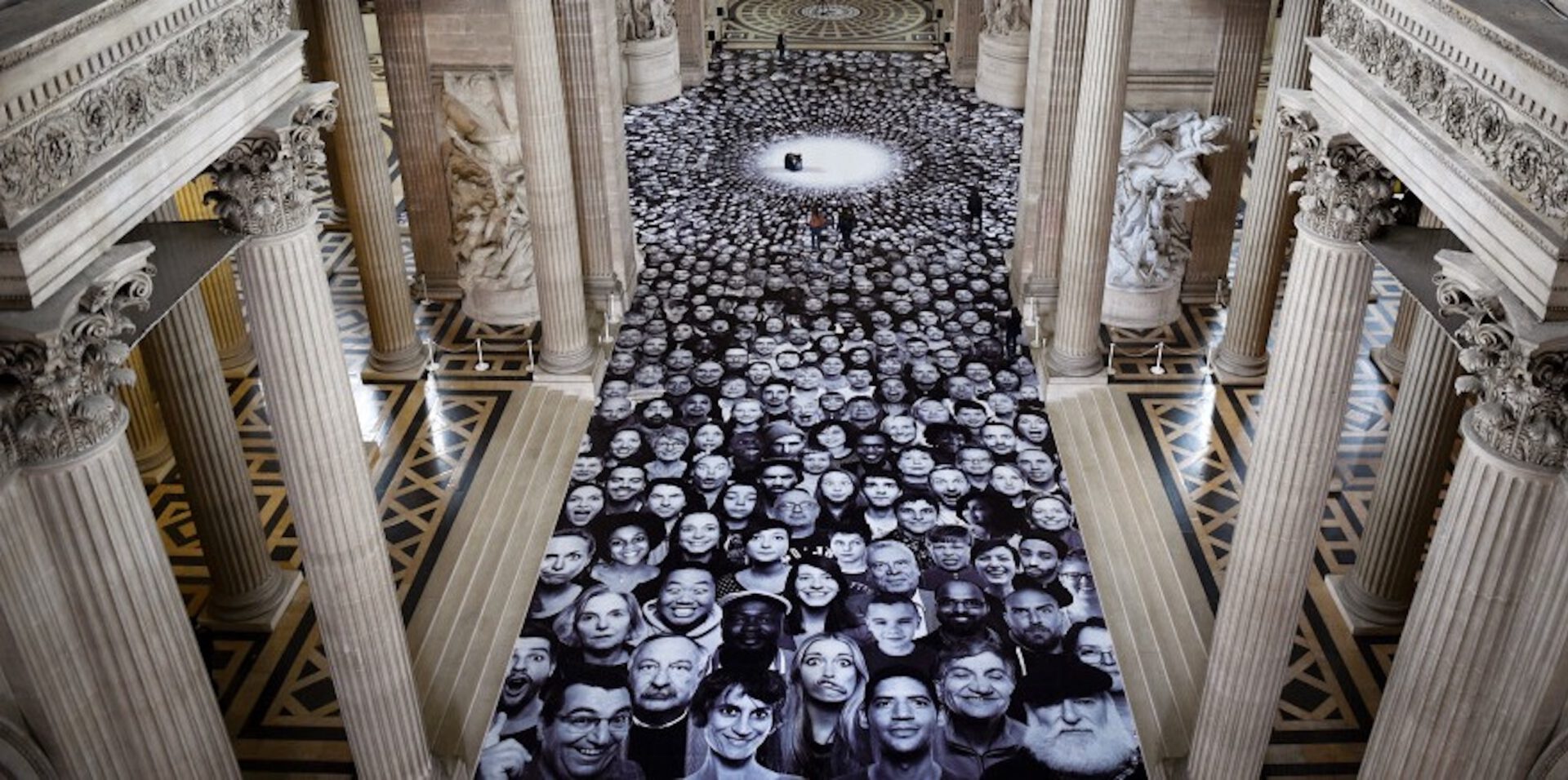 Art in architecture is one of the most successful identity-builing measures for employees whilst generating substantial PR value. Pictured here is architectural art by JR, one of our exhibited artists.